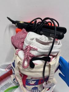 canvas bag with clothes ,sunscreen protections ,  hair straightener HSI